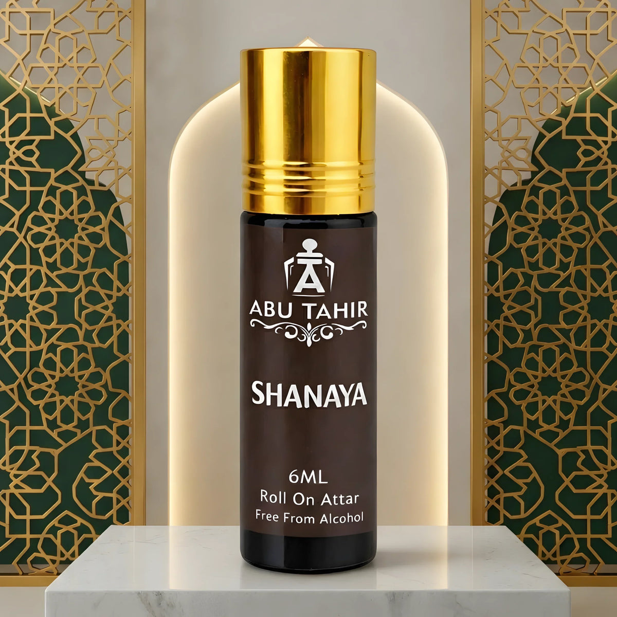 Abu Tahir Shanaya roll-on attar with gold cap on a decorative background